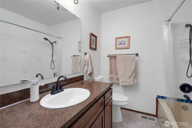 The upstairs full bathroom offers ease for guests or a growing household.