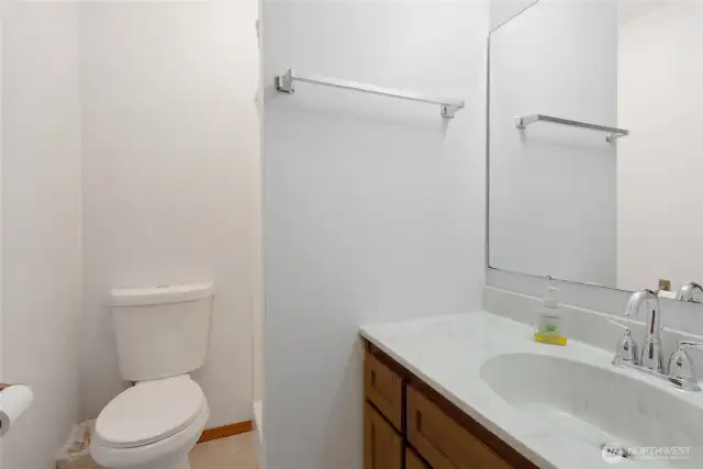 Downstairs 3/4 bathroom with a tub and shower—perfect for guests or everyday use.