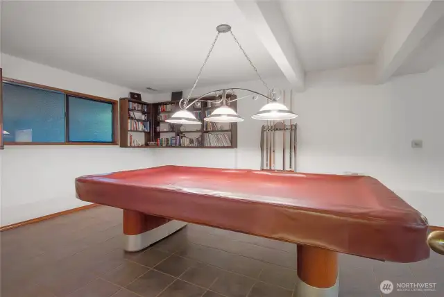 A roomy downstairs rec area with enough space for a full-size pool table—ideal for entertaining.