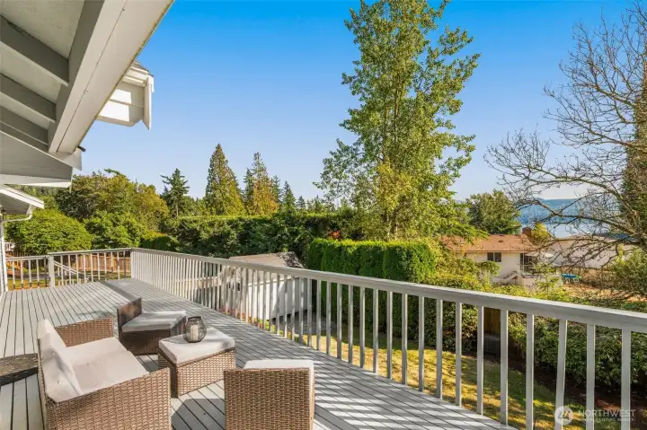 Deck overlooking the outdoor sanctuary and lake views.