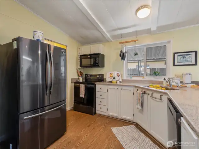 The kitchen has plenty of counterspace and an efficient work flow.