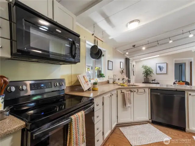 Light and bright. the cook has a view of the guests from just about every angle.