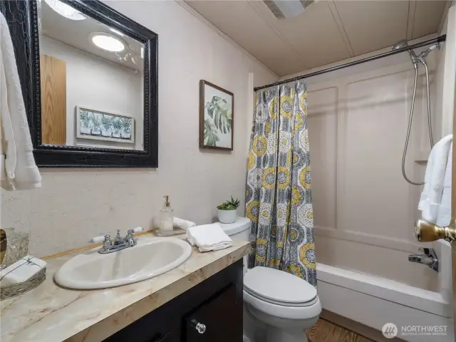 The second bathroom has a bathtub for when you feel like a long luxurious bath.
