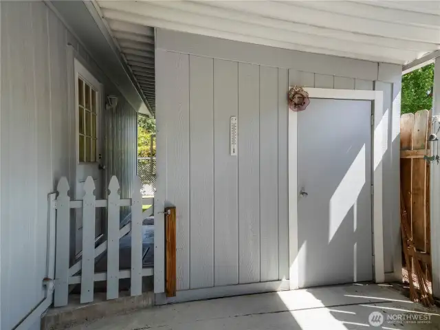 The storage shed holds all your tools and more. It has electricity. Maybe you will use it as a little workshop?