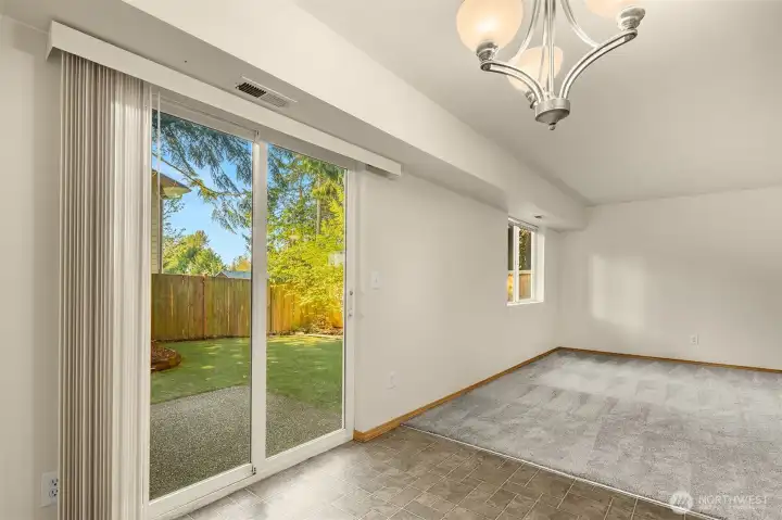 Slider out to back patio and fully fenced yard.