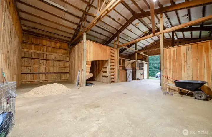 Barn area -4 stalls, grain bin and hay storage