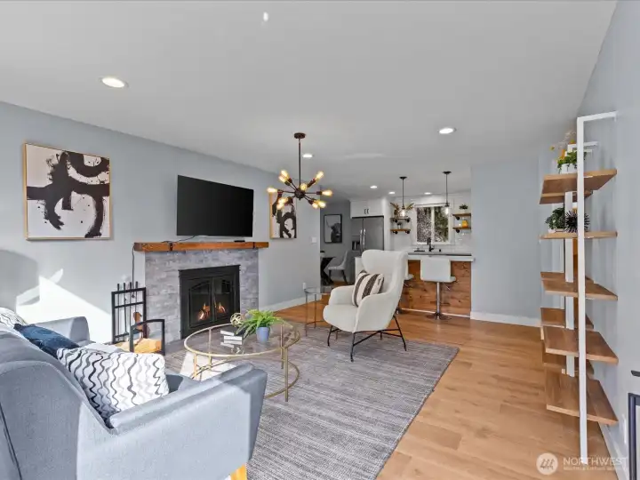 Cozy wood burning fireplace and wide plank flooring greet your guests.