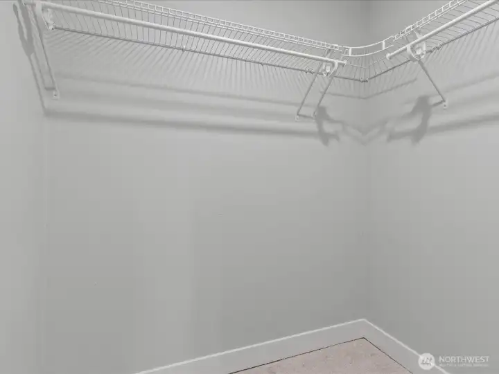 Spacious walk in closet in Primary suite.