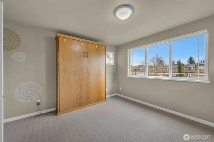 Front upstairs bedroom has a built in Murray bed