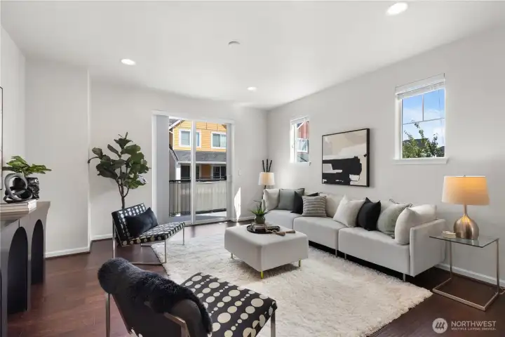 Relax or entertain in the light-filled living area of this end unit.