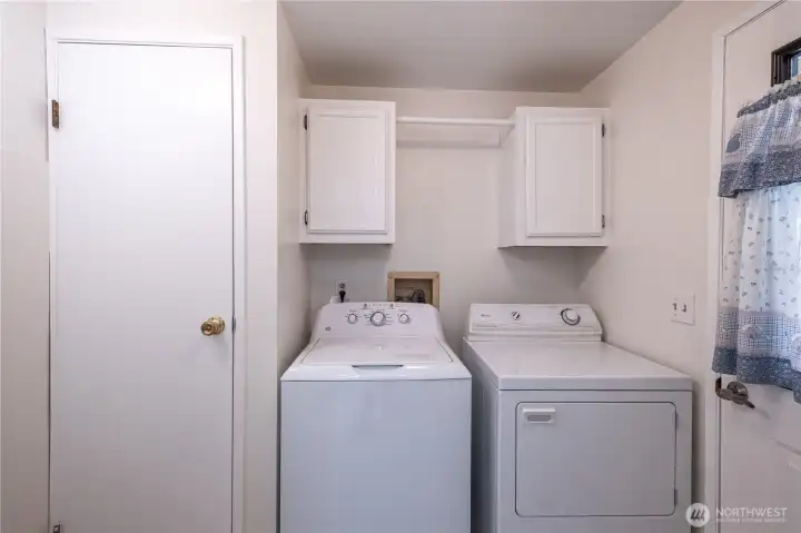 The side entrance is the mud room with washer and dryer (included).