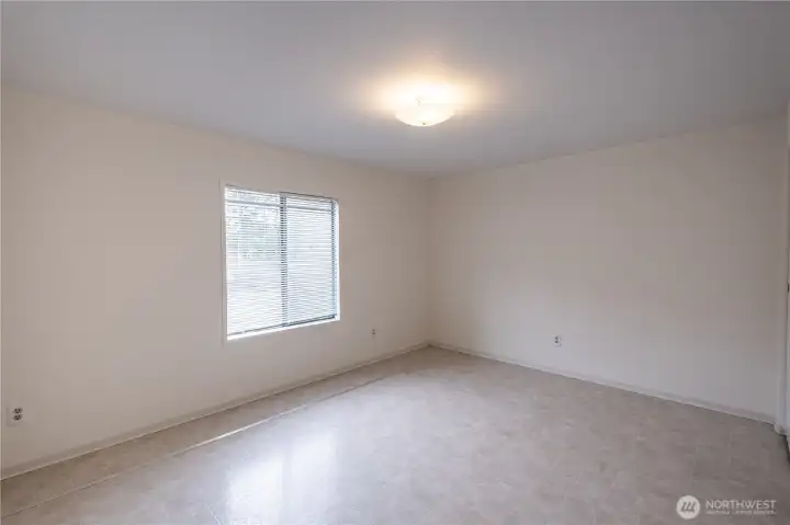The guest bedroom has large closets and access to the second bath that also has a tub.
