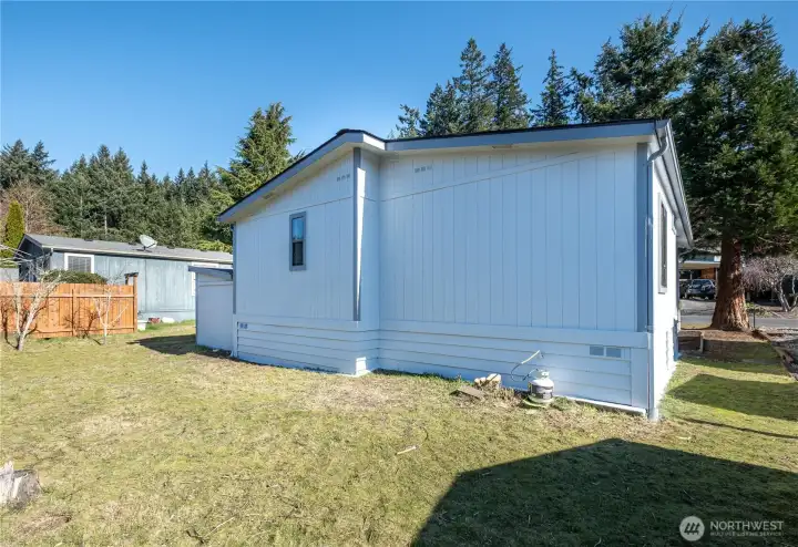 Enjoy the backyard, ready for pets, gardening, or activities.