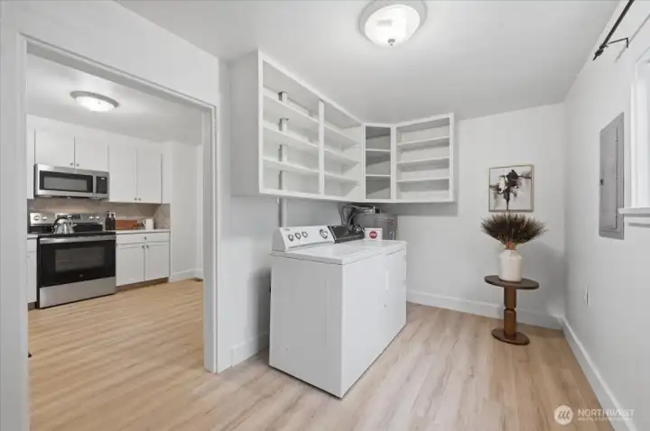 Large laundry area & mudroom off the kitchen and the backdoor.