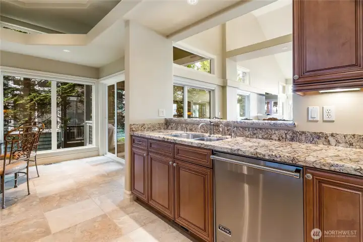 Double stainless kitchen sink overlooking living area and gorgeous view of Drayton Harbor