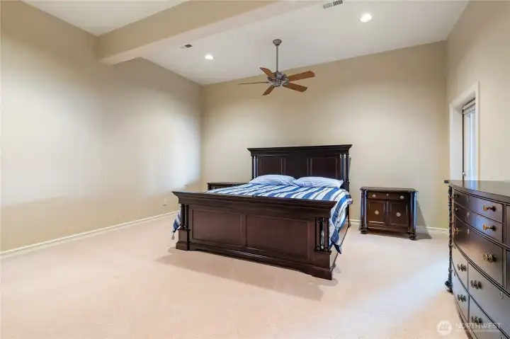 Lower level guest room, with door leading to covered patio