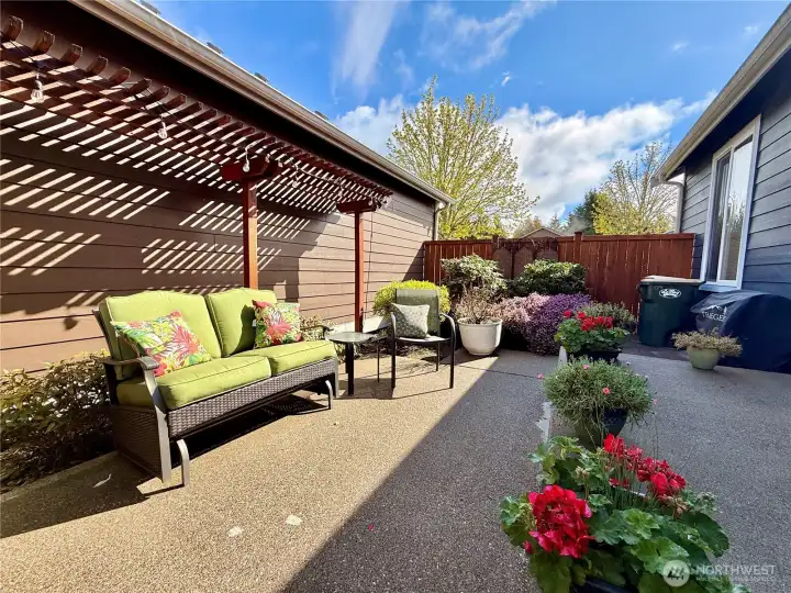 Extensive fenced in patio with mature low maintenance landscaping.