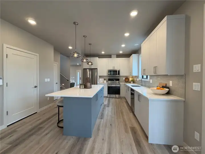 Dual toned cabinets and super functional work space.