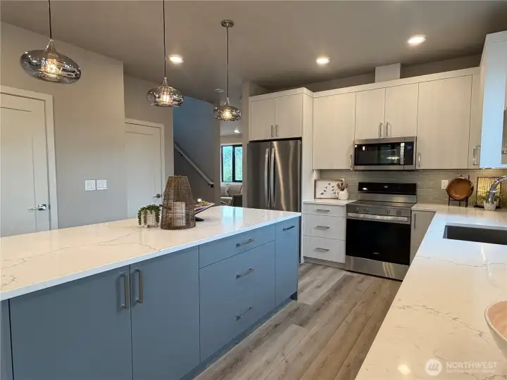 Kitchen sits between the dining and living room for great entertaining flow.