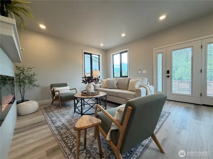 Full light front door with sidelights with internal blinds for privacy.