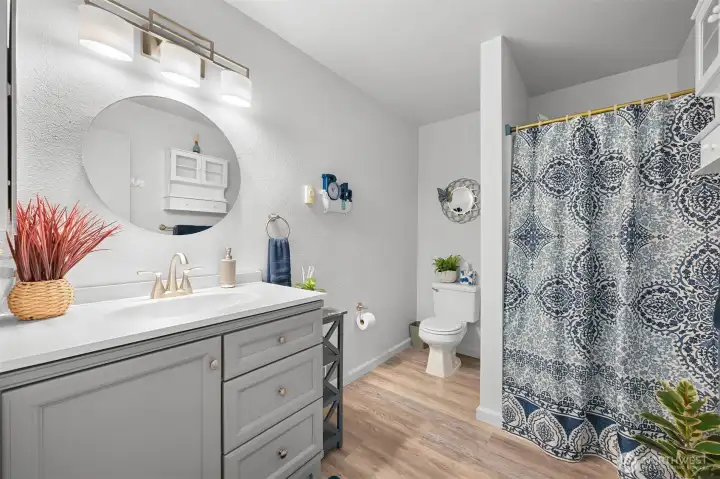 Main floor guest bathroom with shower.