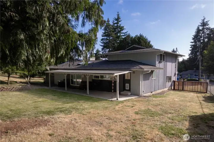The oversized back yard that is fenced. The oversized back yard that is fenced.