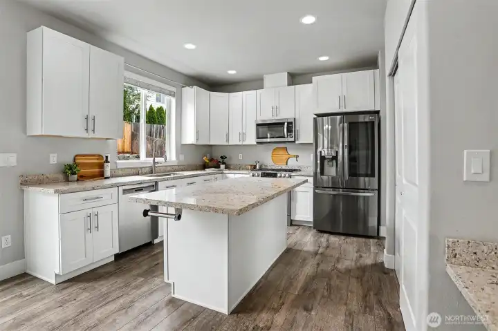 The gourmet kitchen features granite countertops, shaker cabinetry, stainless appliances and a gas range. The gourmet kitchen features granite countertops, shaker cabinetry, stainless appliances and a gas range.