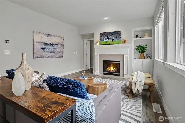 Generously sized family room with another gas fireplace and built-in cabinetry. Generously sized family room with another gas fireplace and built-in cabinetry.