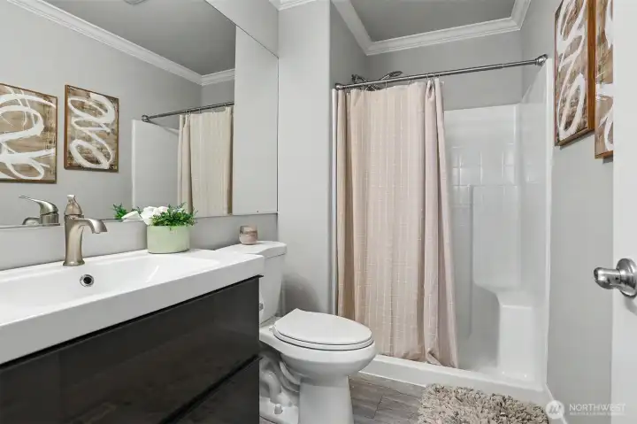 Main floor bathroom with shower stall and designer vanity. Main floor bathroom with shower stall and designer vanity.