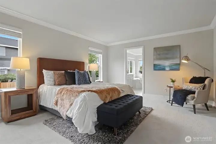 The primary bedroom suite features a double door entrance, newly remodeled full bathroom and walk-in closet. The primary bedroom suite features a double door entrance, newly remodeled full bathroom and walk-in closet.