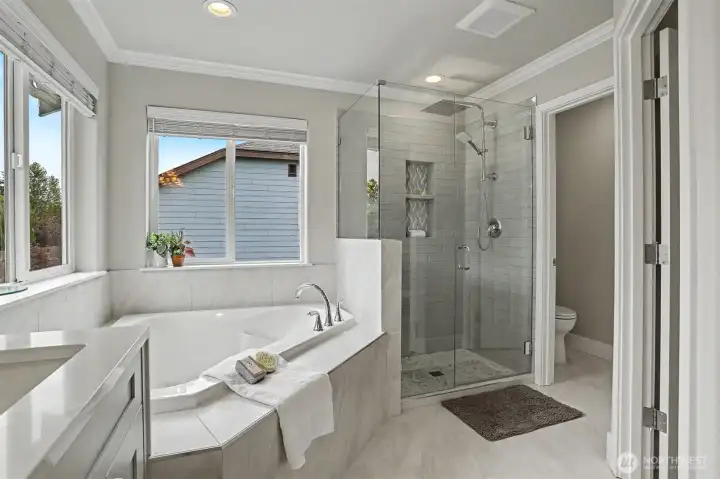 The primary bathroom has a large soaking tub, gorgeous tile shower and a separate toilet area. The primary bathroom has a large soaking tub, gorgeous tile shower and a separate toilet area.