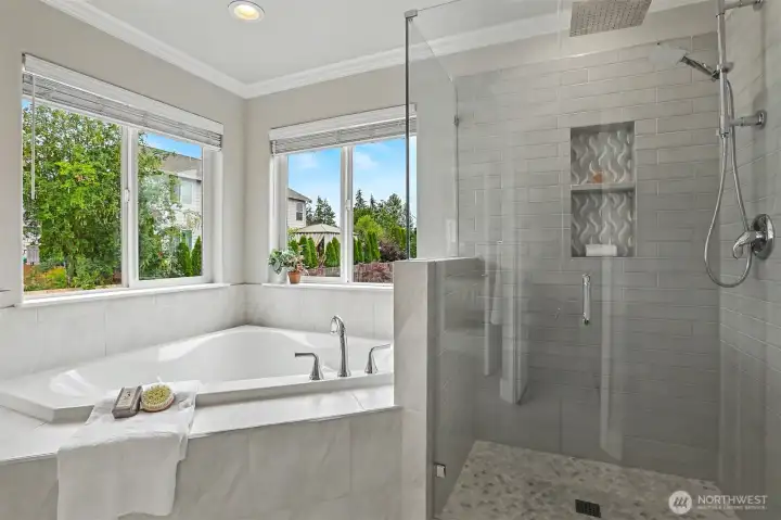 Another shot of the beautiful tile work in the shower and the peaceful soaking tub. Another shot of the beautiful tile work in the shower and the peaceful soaking tub.