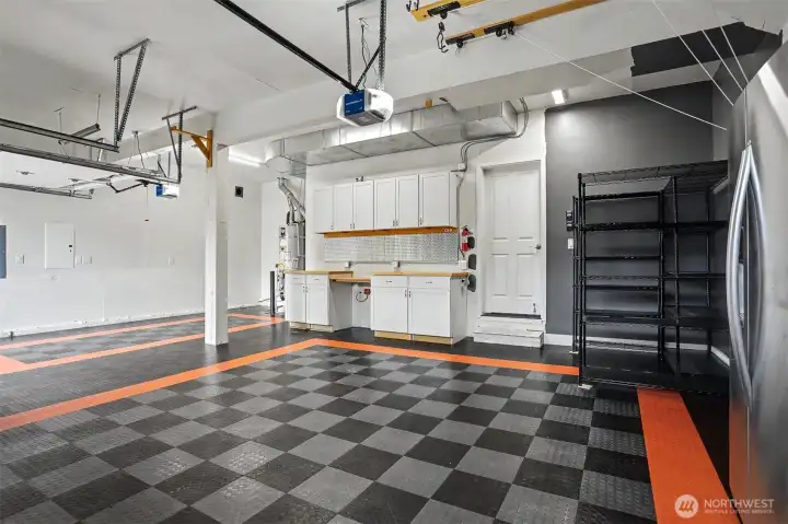 Big three car garage has room for vehicles and shop space Big three car garage has room for vehicles and shop space