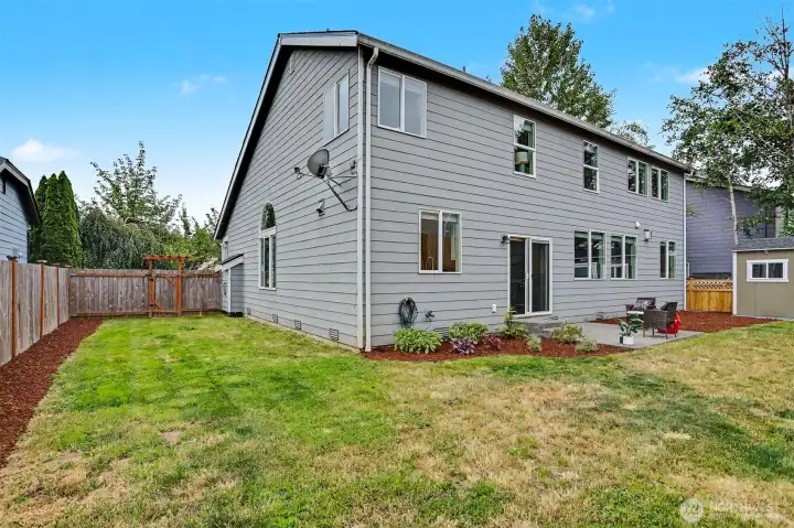 The backyard is fully fenced with room for gardens as well as play equipment. The backyard is fully fenced with room for gardens as well as play equipment.
