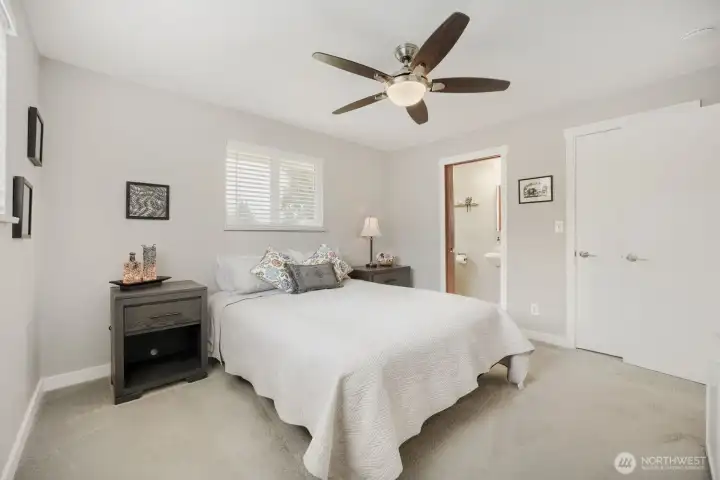 Primary Bedroom + Entry to 1/2 Bath