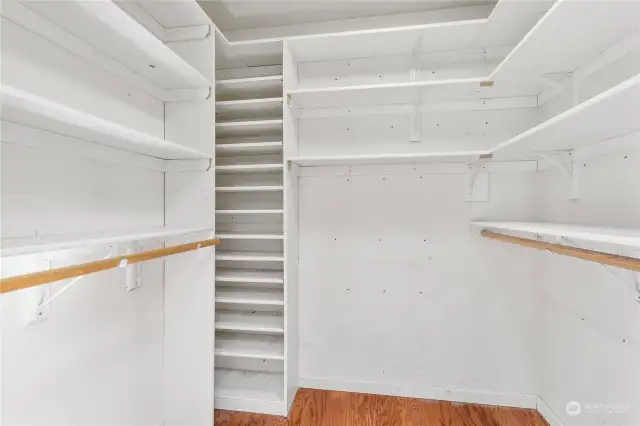 Spacious walk in closet with shelving in Primary suite.
