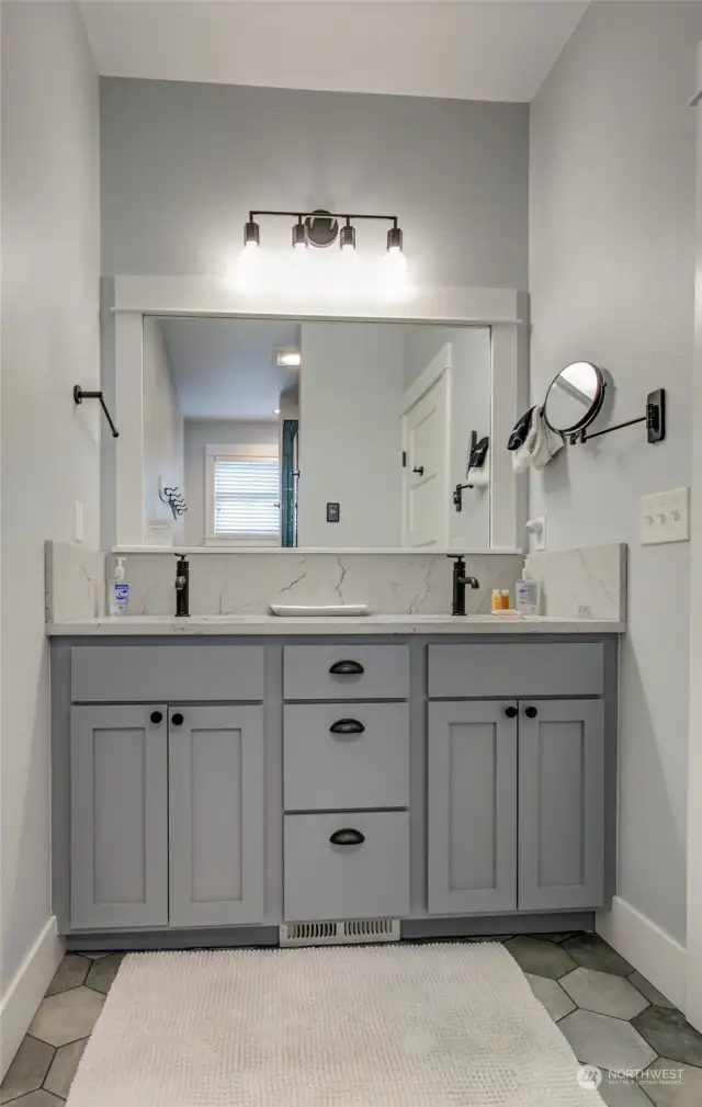 The primary bath remodel was just completed. Quartz countertops, double sinks, and lots of storage.