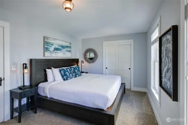 The West bedroom offers a peek of view and is oversized.