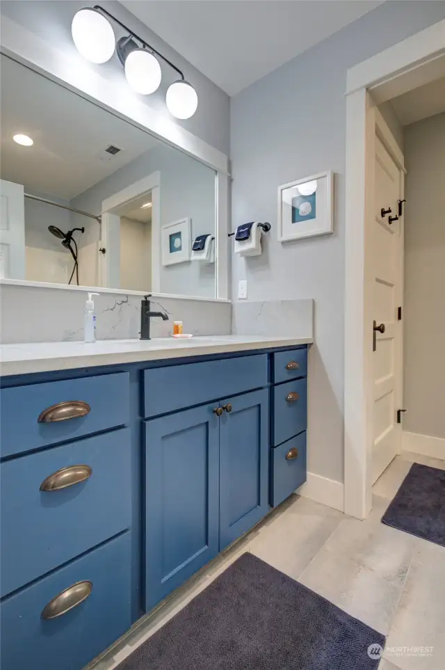 The full bath upstairs also has a double vanity, tub shower and private commode room. Newly remodeled!