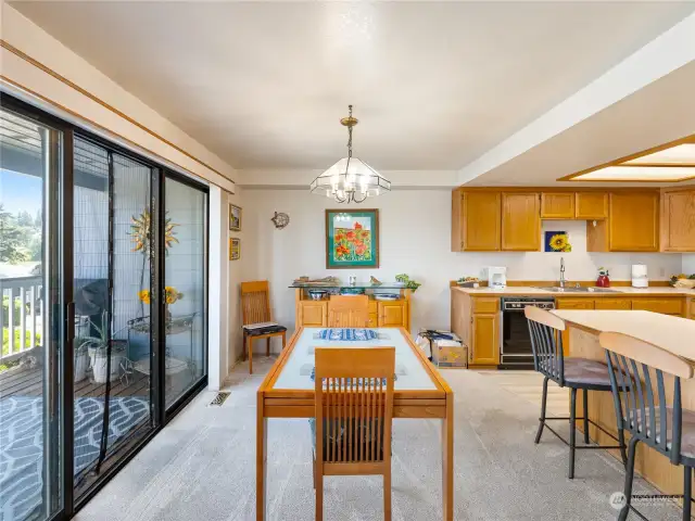 Dining area with glass doors to deck.