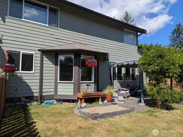 Fully fenced backyard with patio.