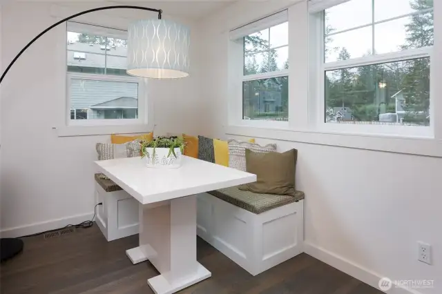 Dining area adjacent to the kitchen with built in bench and table that stay.