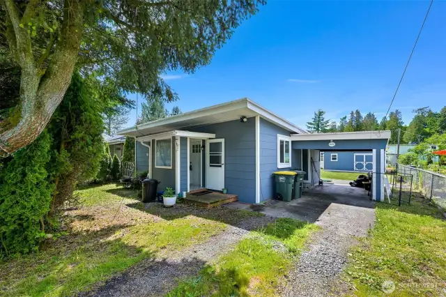 Enclosed front porch and car port