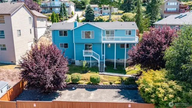 Rear of the home with the spacious yard