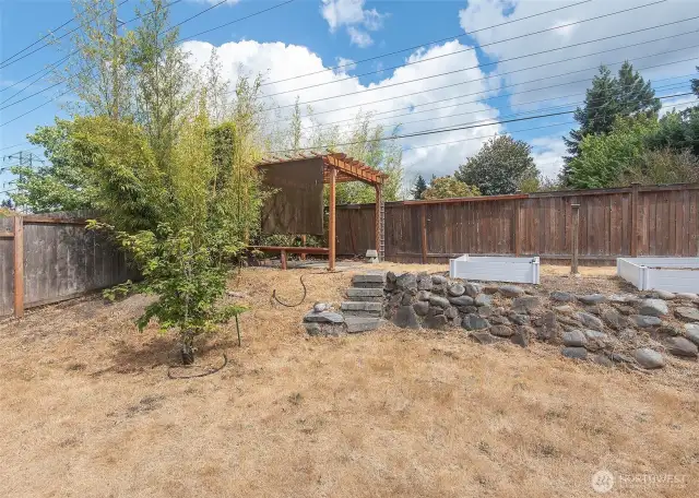 Gazebo and fully fenced back yard.