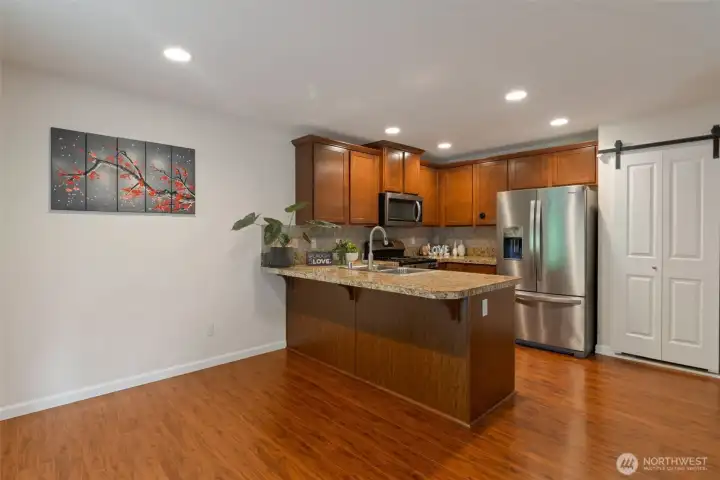 Newly replaced refrigerator and dishwasher. Modern sliding door recently installed.