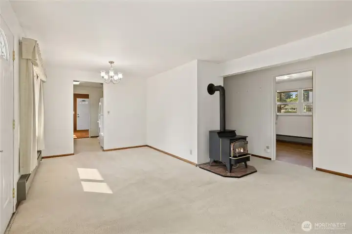 Main living area, looking through dining space and into kitchen.