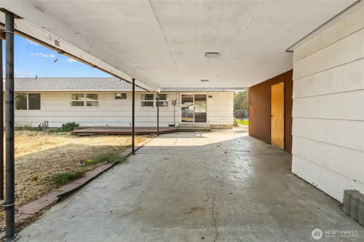 Large detached carport with storage on the right side.