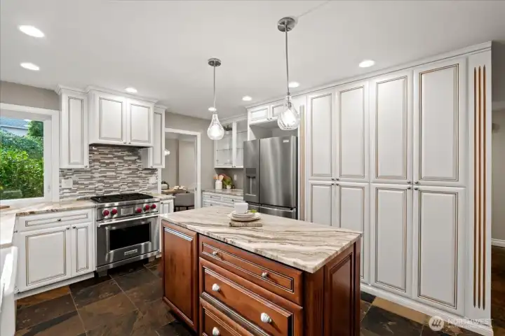 This custom kitchen remodel is absolutely stunning! The detail and craftsmanship of the finishes will be the envy of all your guests. From top of the line appliances, floor to ceiling pantries and lighted upper cabinets, what more could you ask for? You will love cooking on the dual fuel gas Wolf range and bragging about the dolomite "hard marble" countertops.