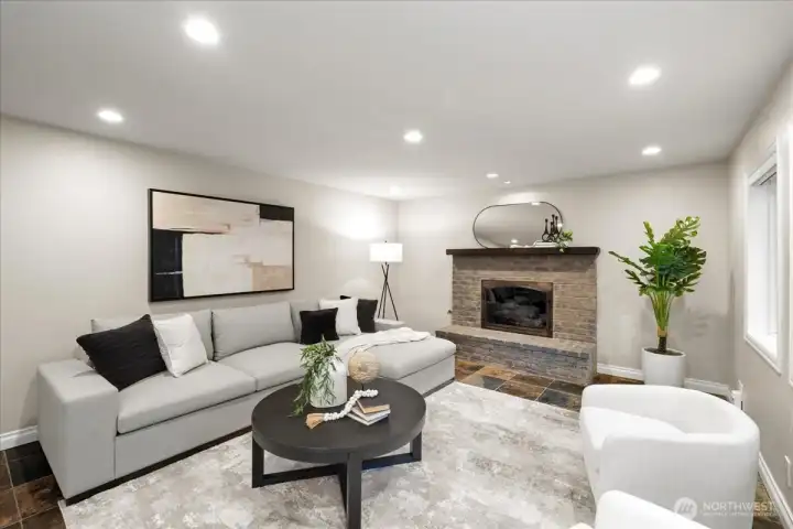 Recessed lighting on dimmers and large windows brighten the family room space!